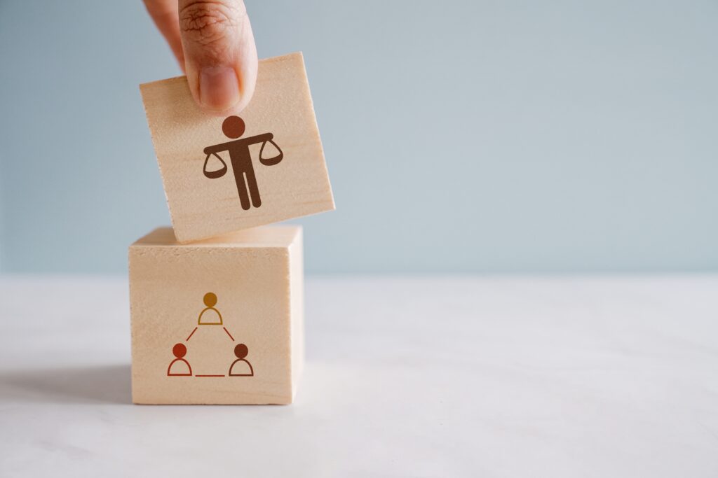 hand,holding,wooden,block,with,ethical,icons,,business,ethics,and